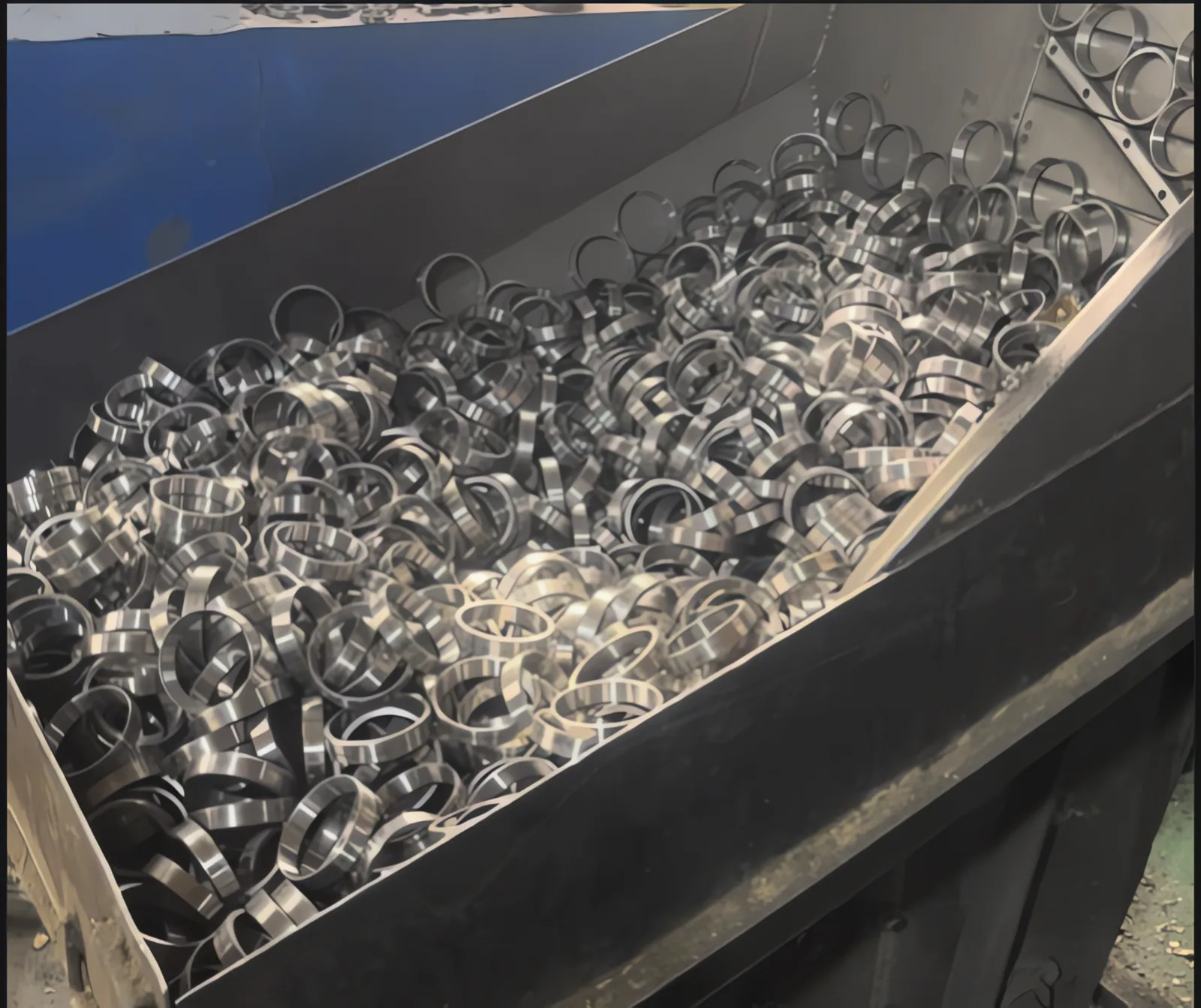 Steel bin filled with machined bearing rings waiting for the next process