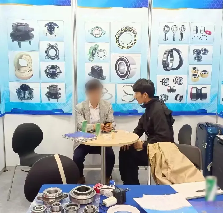 FULI sales staff talking with a visitor across a small table at a trade fair booth, bearing samples in the foreground