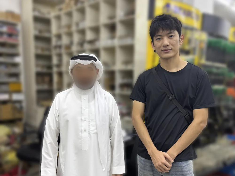FULI staff member with a customer at his tools and bearings shop overseas