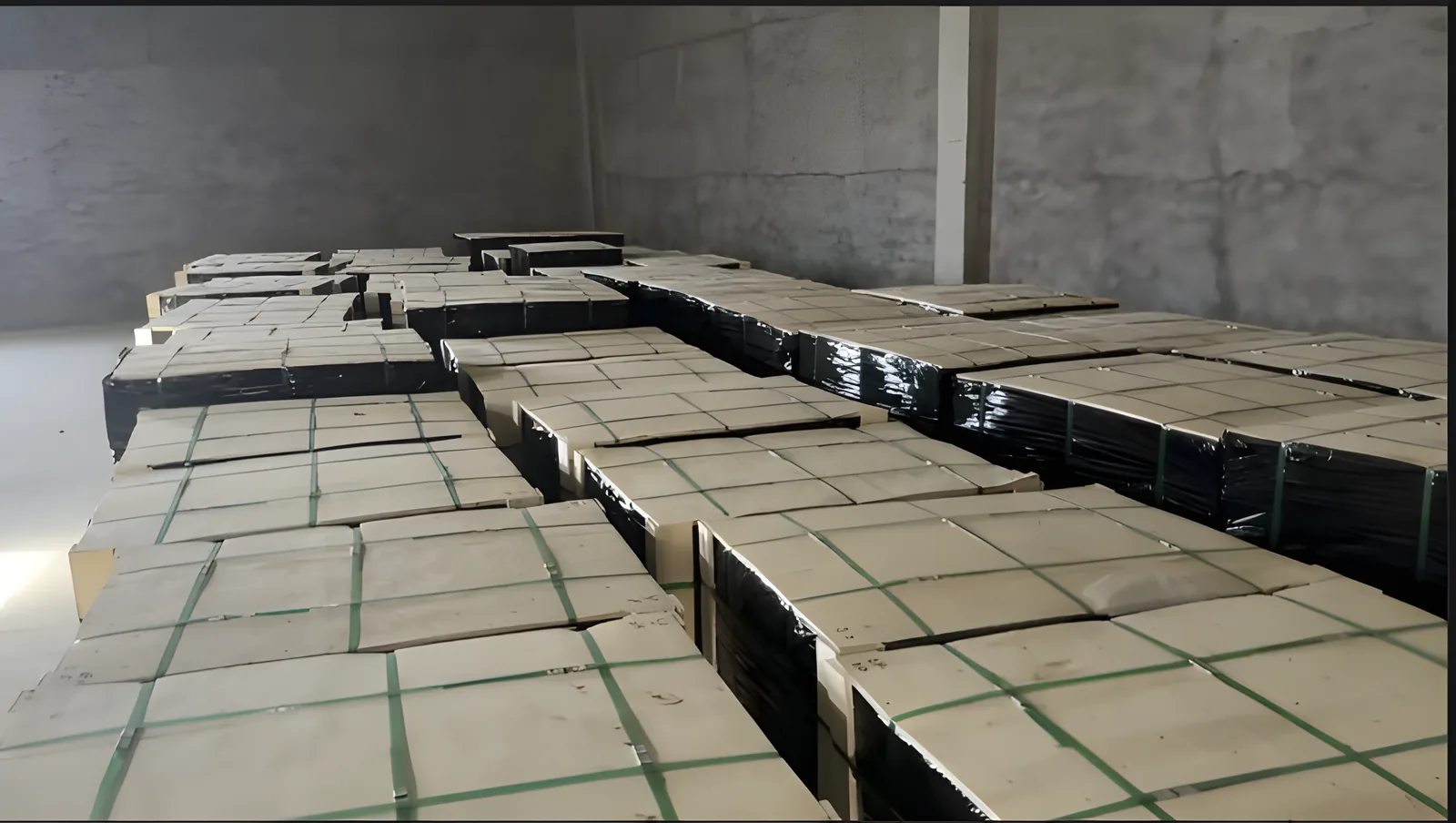 Strapped and shrink-wrapped pallets of bearing cartons lined up in the FULI warehouse before shipment