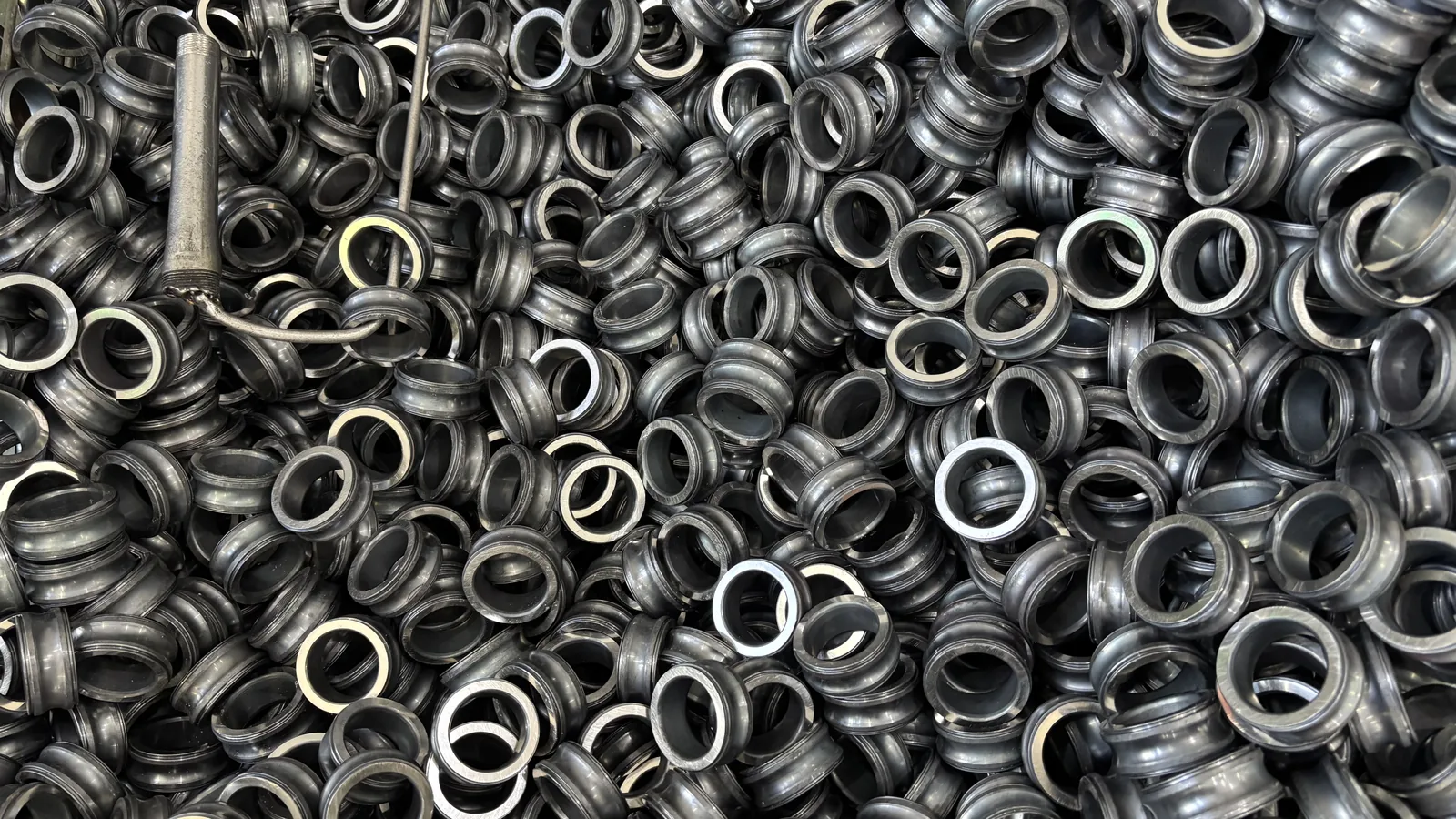 A bin filled with turned steel bearing rings